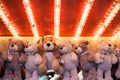 Stuffed toy bears on display awarded as winning prizes at Christmas funfair winter wonderland