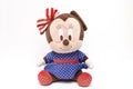 A stuffed toy of the Walt Disney cartoon animation character Minnie Mouse