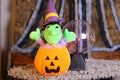 Stuffed witch inside carved pumpkin Royalty Free Stock Photo