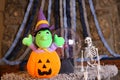 Stuffed witch inside carved pumpkin Royalty Free Stock Photo