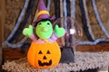 Stuffed witch inside carved pumpkin Royalty Free Stock Photo
