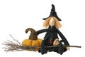 Stuffed witch toy with broom and pumpkin Royalty Free Stock Photo