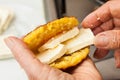 Stuffing the cooked corn bread with cheese