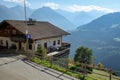 Alpine village of Stulles in province of Bolzano. Restaurant with terrace overlooking the Alps. South Tyrol, Italy