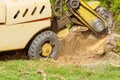 A stump is shredded with removal, grinding in the stumps and roots into small chips