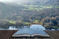 Stuning vibrant Autumn Fall landscape image of view from Gummers How down onto Derwent Wter in Lake District coming out of pages