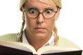 Stunned Blonde With Ponytails Reads a Book Royalty Free Stock Photo