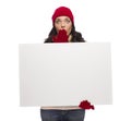 Stunned Girl Wearing Winter Hat and Gloves Holds Blank Sign Royalty Free Stock Photo