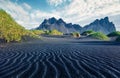 Stunnin summer view of Stokksnes cape with Vestrahorn Batman Mountain on background. Amazing Icelandic landscape with black sand