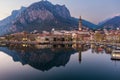 Stunning aerial cityscape of Lecco town on spring evening. Picturesque waterfront of Lecco town located between famous Lake Como