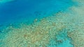 Stunning aerial drone image of a great coral reef marine channel in calm weather flat water and incredible colorful sea ocean bed