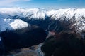 Stunning aerial image of the mouth of the glacier at Lake Wanaka surrounded by snow capped mountains taken on a sunny winter day, Royalty Free Stock Photo