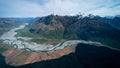 Stunning aerial image of the mouth of the glacier at Lake Wanaka surrounded by snow capped mountains taken on a sunny winter day, Royalty Free Stock Photo