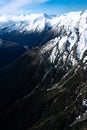 Stunning aerial image of the mouth of the glacier at Lake Wanaka surrounded by snow capped mountains taken on a sunny winter day, Royalty Free Stock Photo