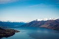 Stunning aerial image of the Wanaka lake with the snowy Mount Aspiring in the background on a sunny winter day, New Zealand Royalty Free Stock Photo