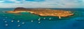 Stunning aerial panoaramic view of the yachts and catamarans moored up on the leeward side of the island of Lobos Island Royalty Free Stock Photo