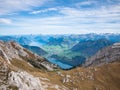 Stunning aerial panorama view of Lucerne lake and Swiss Alps mountain range from top of Pilatus on a sunny autumn day with Royalty Free Stock Photo