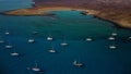 Stunning aerial reveal clip of the island of Lobos as well as the yachts and catamarans moored on the leeward side