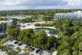 A stunning aerial shot of the bronze hand shaped sculpture at the Holocaust Memorial Miami Beach surrounded by a pond
