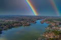 A stunning aerial shot of the Catawba River surrounded by vast miles of green and autumn colored trees with blue sky, a rainbow Royalty Free Stock Photo