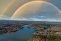 A stunning aerial shot of the Catawba River surrounded by vast miles of green and autumn colored trees with blue sky, a rainbow Royalty Free Stock Photo