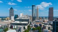 A stunning aerial shot of the city skyline with skyscrapers in downtown Atlanta Georgia with blue sky
