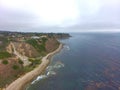 Stunning aerial shot of the deep blue ocean water and the coastline at at Bluff Cove beach Royalty Free Stock Photo