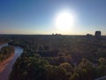 A stunning aerial shot of vast miles of lush green trees, the freeway, the Chattahoochee river and blue sky at sunset Royalty Free Stock Photo