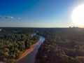 A stunning aerial shot of vast miles of lush green trees, the freeway, the Chattahoochee river and blue sky at sunset Royalty Free Stock Photo