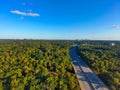 A stunning aerial shot of vast miles of lush green trees, the freeway, the Chattahoochee river and blue sky at sunset Royalty Free Stock Photo