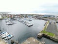 Stunning aerial view of Ardrossan marina, showing a vast array of colorful boats in Scotland