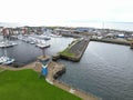 Stunning aerial view of Ardrossan marina, showing a vast array of colorful boats in Scotland