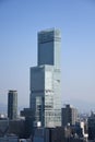 a large city skyline with a building in the foreground