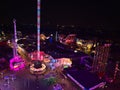 Stunning aerial view over illuminated amusement park Wurstelprater at night in Vienna, Austria with rides including drop towers. Royalty Free Stock Photo