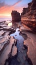 Sunrise over Rocky Cliffs at Beach Royalty Free Stock Photo