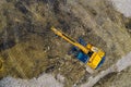 Stopped yellow excavator at a construction site