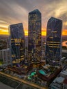 Stunning aerial view of a vibrant city skyline at sunset, featuring Jewel Towers