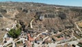 Stunning aerial view of Zaragoza, Spain, featuring the city's iconic dirt mound and lush grasslands