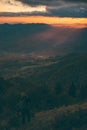 Stunning alpine landscape with golden skies and dramatic clouds