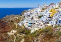 Stunning, amazing and beautiful classic white and caramel color Greek architecture with unbelievable wind mills on Santorini volca Royalty Free Stock Photo