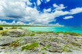 Stunning amazing view from a cliff on tranquil turquoise ocean and beach against blue sky magic background Royalty Free Stock Photo