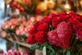 A stunning arrangement of red roses fills a vase, showcasing the beauty of nature indoors, A flower shop filled with vibrant red Royalty Free Stock Photo