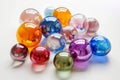 Colorful glass orbs arranged artistically on a light background in a vibrant display of creativity Royalty Free Stock Photo