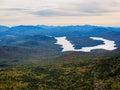 Beautiful fall colors and sky over the Adirondack Mountains with Lake Placid and West Lake in the background in New York state Royalty Free Stock Photo