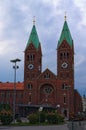 Stunning autumn landscape view of ancient Basilica of Our Mother of Mercy against vibrant sky