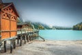 Wooden boathouse and misty autumn landscape, Dolomites, Italy, Europe