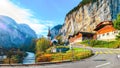 Stunning autumn view of Lauterbrunnen village with awesome waterfall  Staubbach  and Swiss Alps in the background Royalty Free Stock Photo