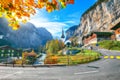 Stunning autumn view of Lauterbrunnen village with awesome waterfall  Staubbach  and Swiss Alps in the background Royalty Free Stock Photo