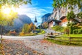 Stunning autumn view of Lauterbrunnen village with awesome waterfall  Staubbach  and Swiss Alps in the background Royalty Free Stock Photo