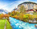 Stunning autumn view of Lauterbrunnen village with awesome waterfall  Staubbach  and Swiss Alps in the background Royalty Free Stock Photo